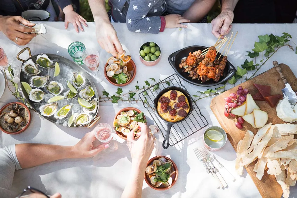 Family Eating Together Around A Table