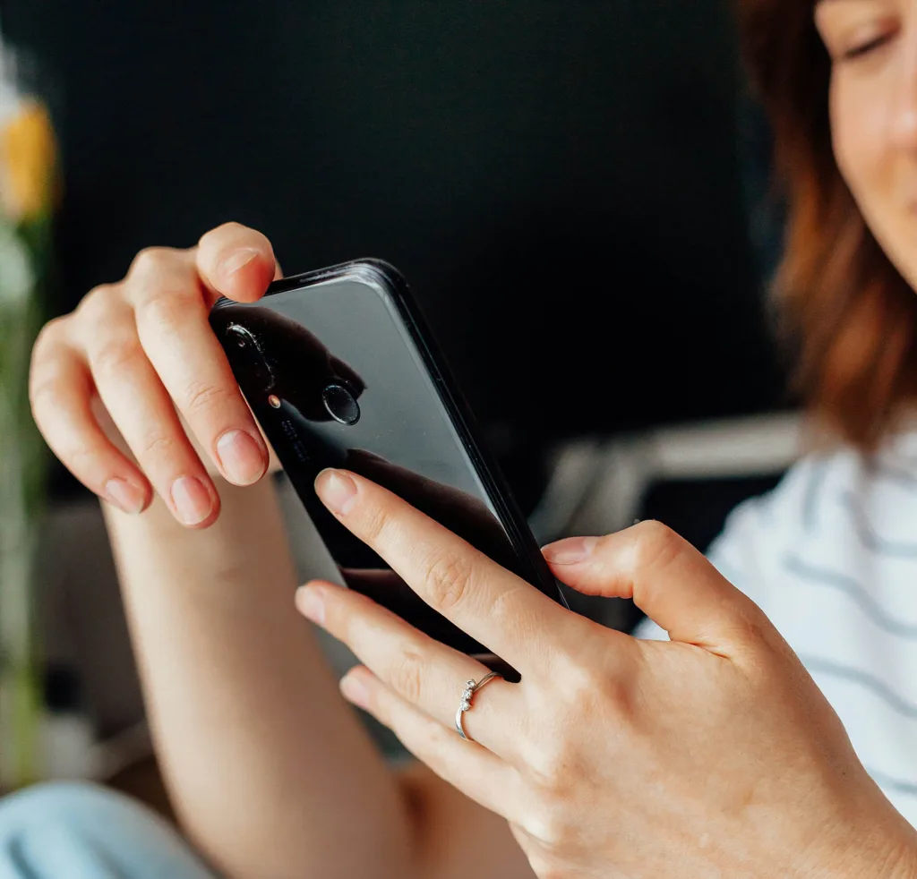 Lady Studying Happily On Her Phone